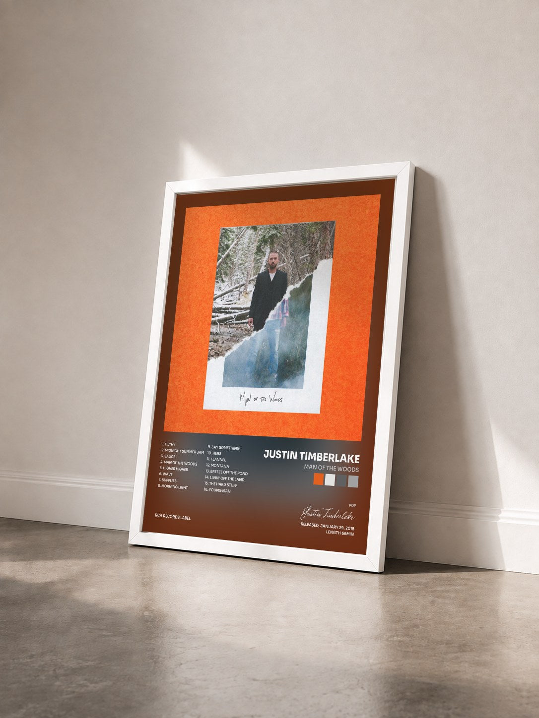 #blanc Man of the Woods by Justin Timberlake as a framed art print seen at an angle, white frame