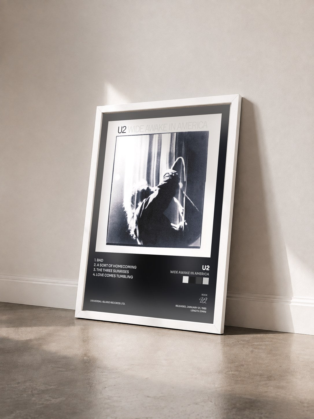 #blanc Wide Awake In America by U2 as a framed art print seen at an angle, white frame