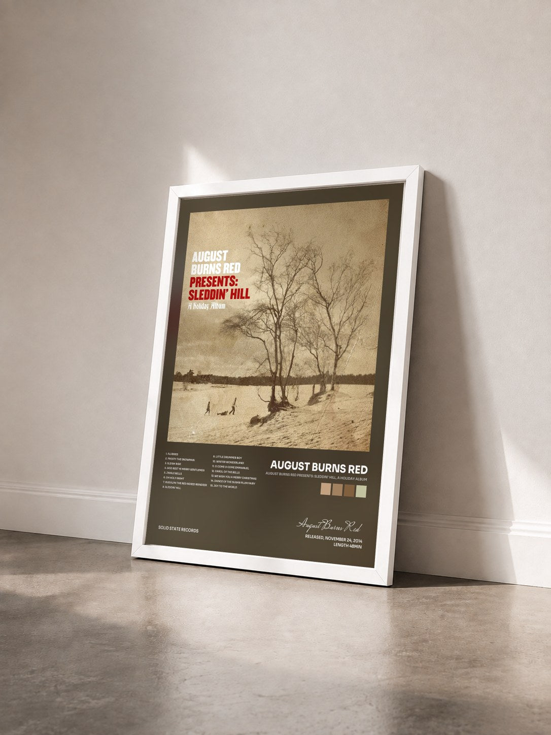 #blanc Tableau de l'album August Burns Red Presents: Sleddin' Hill, A Holiday Album de August Burns Red vu de trois quarts, cadre blanc