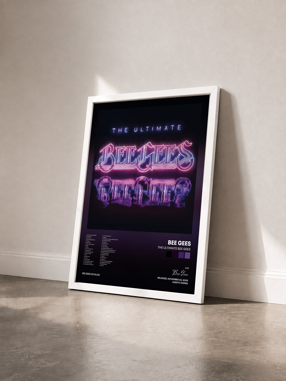 #blanc The Ultimate Bee Gees by Bee Gees as a framed art print seen at an angle, white frame