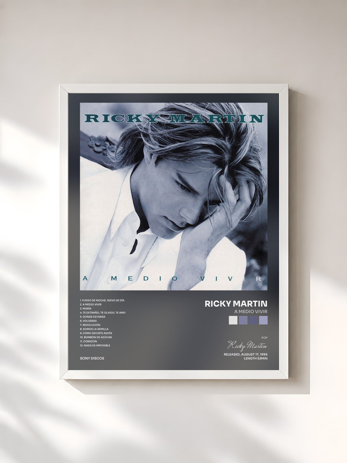 #blanc A Medio Vivir by Ricky Martin as a framed art print, white frame, printed and framed in France