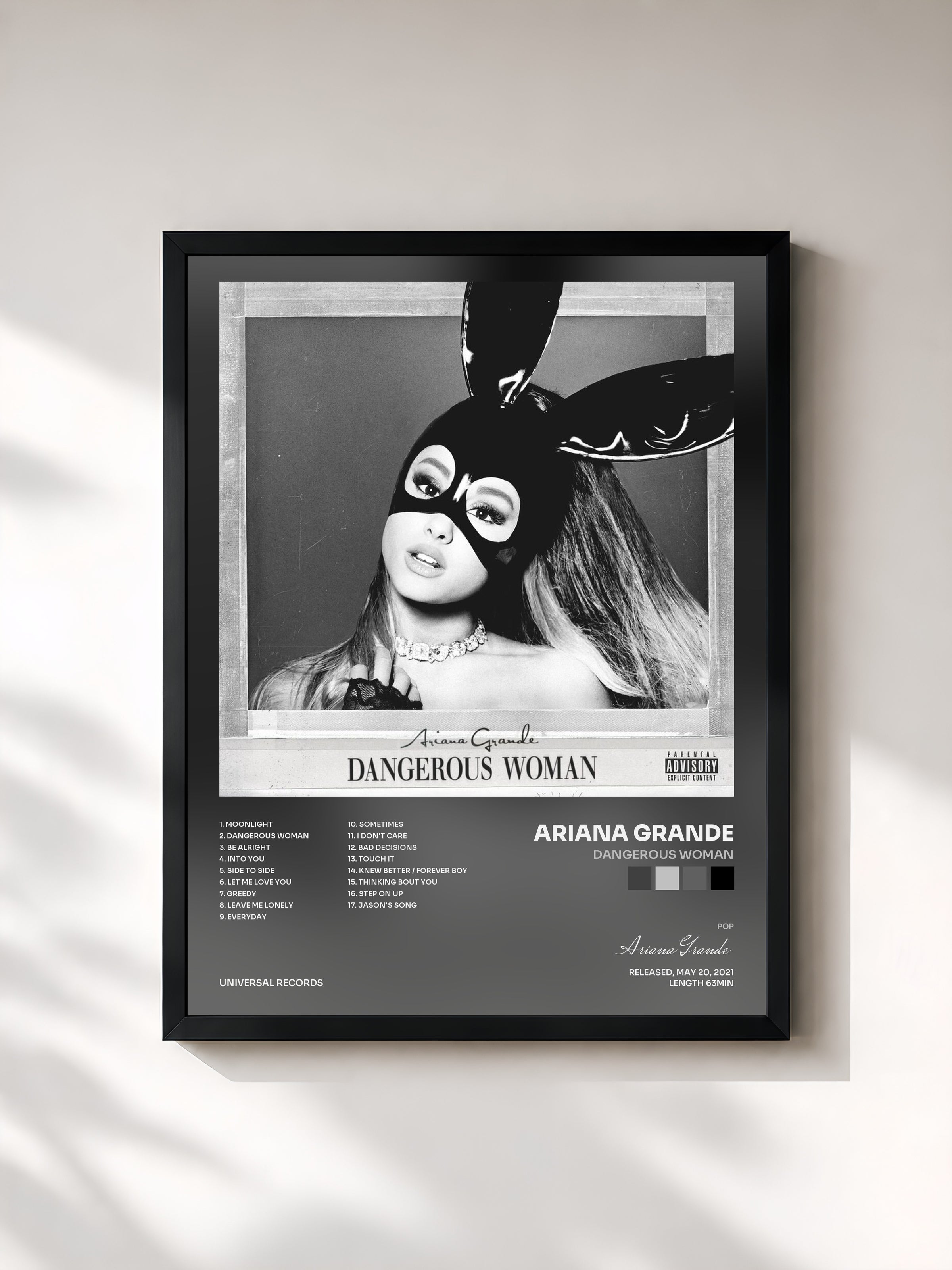#noir Dangerous Woman by Ariana Grande as a framed art print, black frame, printed and framed in France